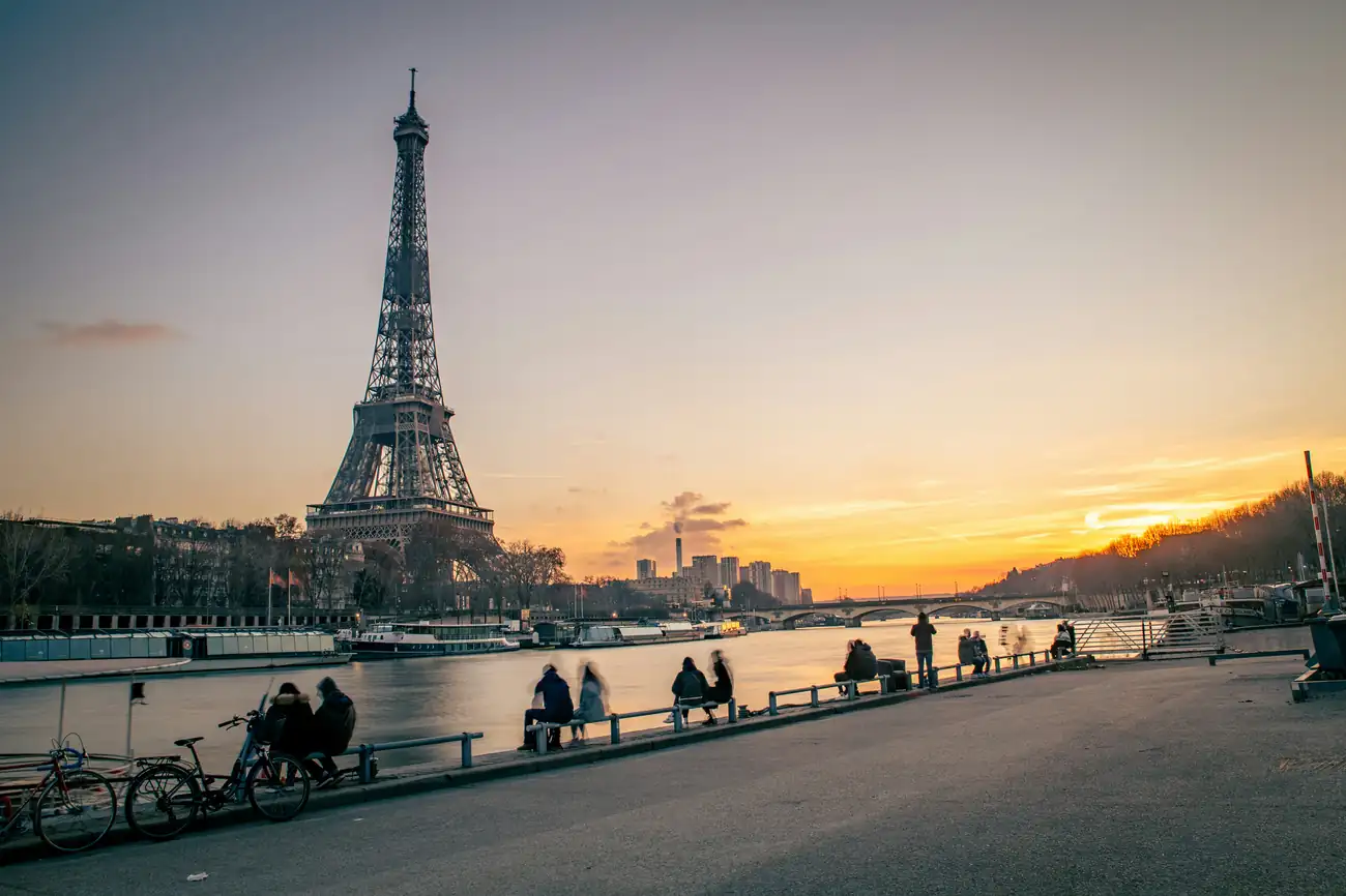 Eiffel Tower beside the Seine at sunset